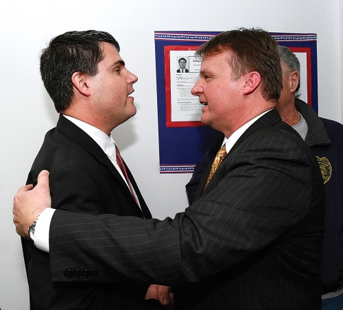 Incumbent Republican Mayor Mike Bronko (right) and Democratic candidate Bob Mezzo congratulate one another after their victories in Monday's primaries. Bronko defeated former Mayor Ron San Angelo, and Mezzo beat former state Rep. Kevin Knowles. Bronko and Mezzo will meet in the May 4 general election.
